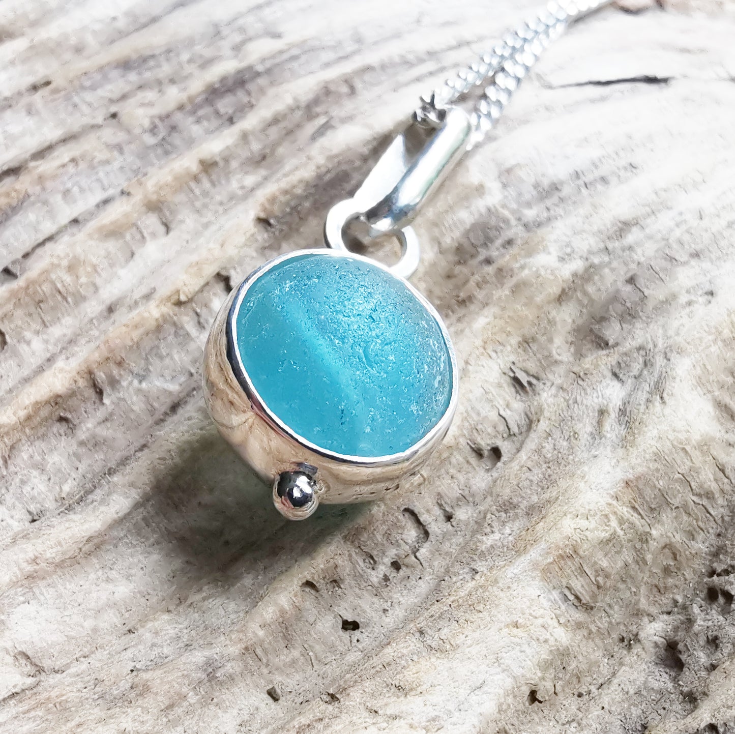 Tiny Seaham aqua blue sea glass marble & sterling silver pendant.