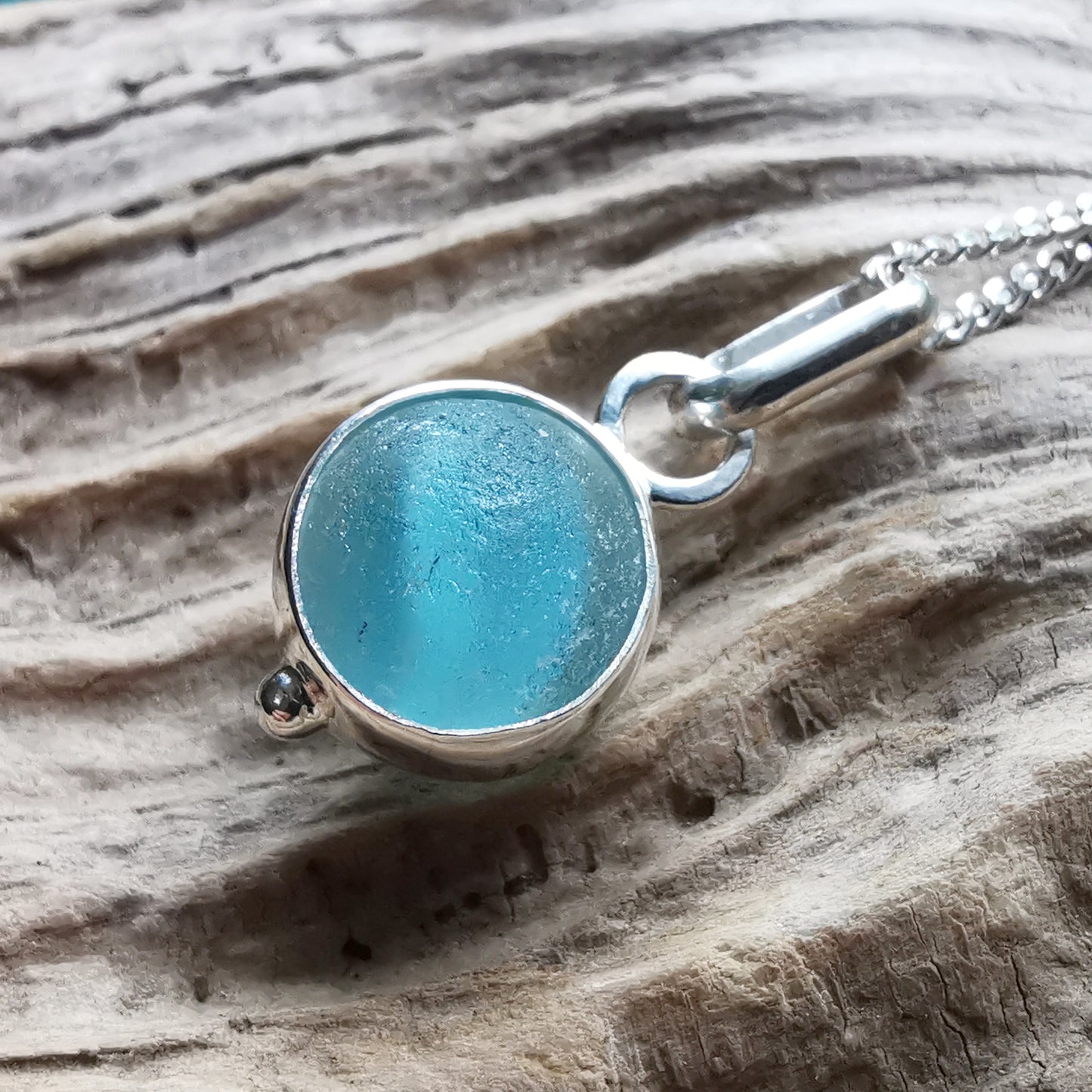 Tiny Seaham aqua blue sea glass marble & sterling silver pendant.