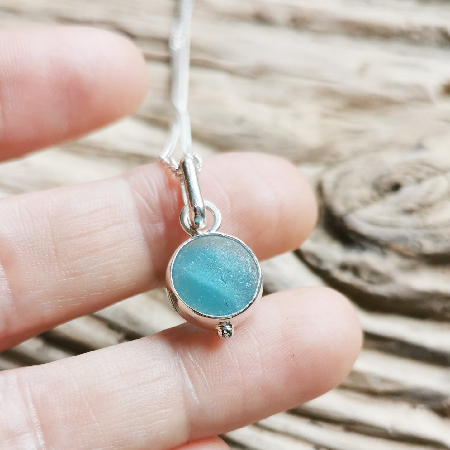 Tiny Seaham aqua blue sea glass marble & sterling silver pendant.