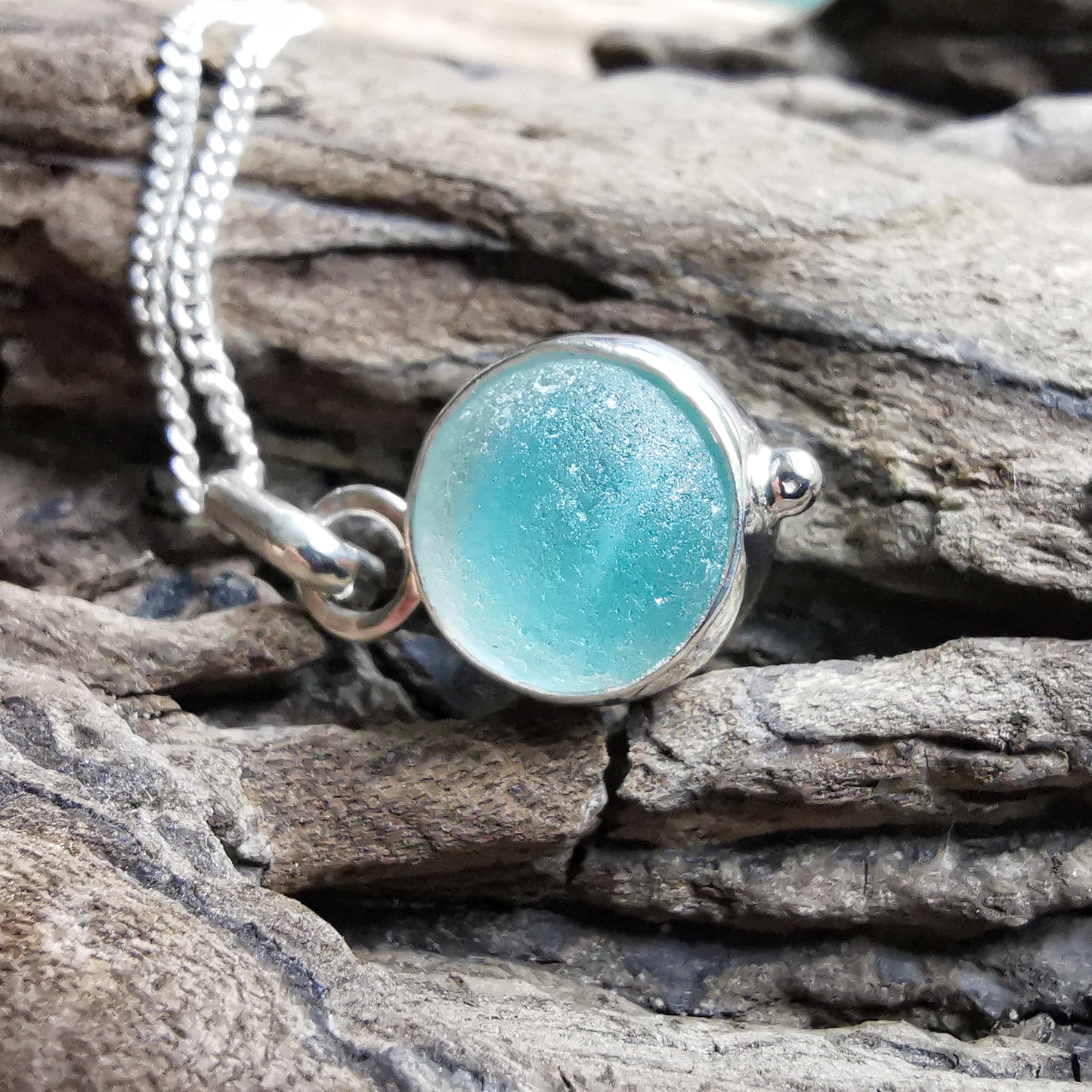 Tiny Seaham aqua blue sea glass marble & sterling silver pendant.