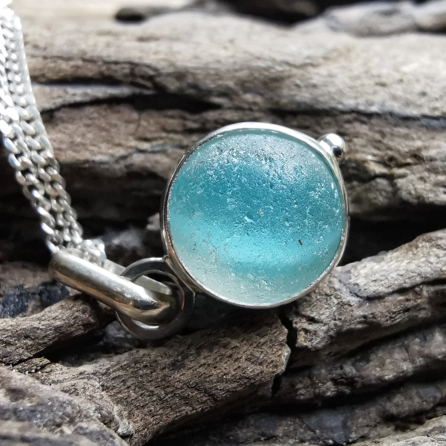 Tiny Seaham aqua blue sea glass marble & sterling silver pendant.