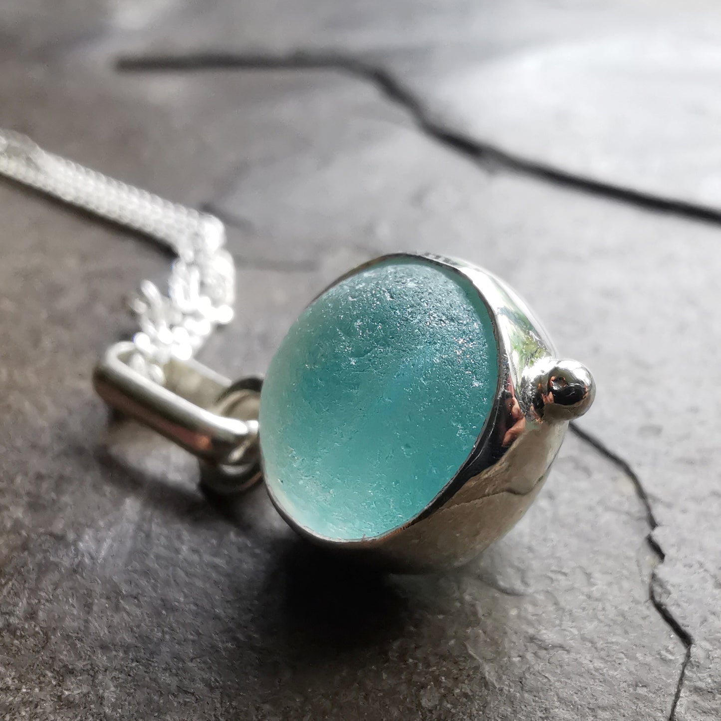 Tiny Seaham aqua blue sea glass marble & sterling silver pendant.