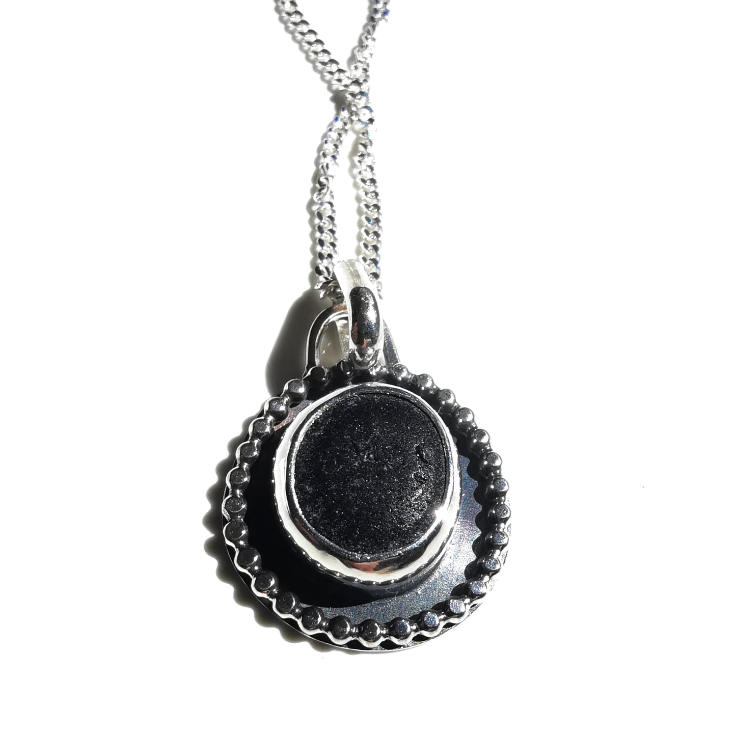 Seaham black sea glass with hidden colour & sterling silver pendant.