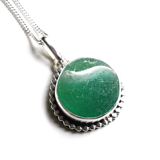 Scottish teal green sea glass marble & sterling silver pendant.