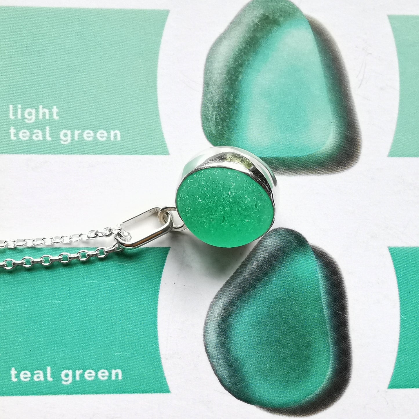 Scottish teal green sea glass marble & sterling silver pendant.