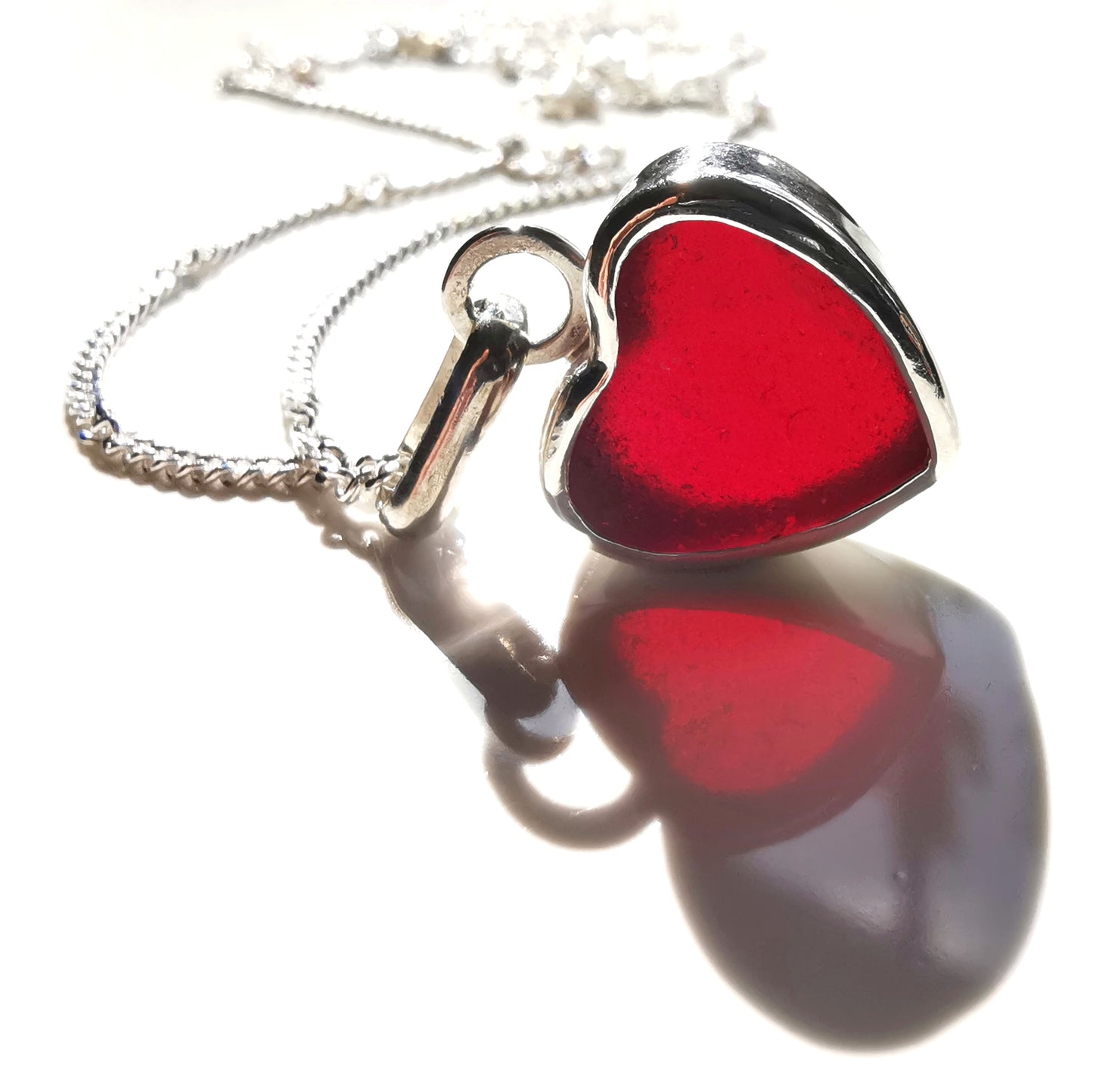 Burgundy red sea glass heart & sterling silver pendant.