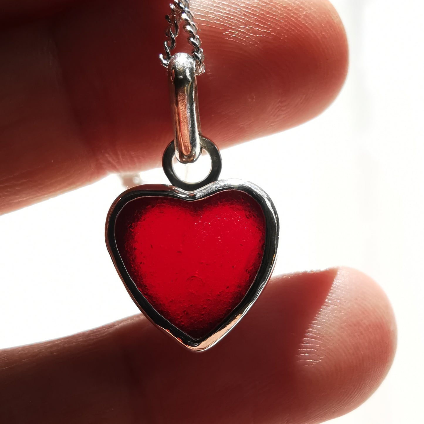 Burgundy red sea glass heart & sterling silver pendant.