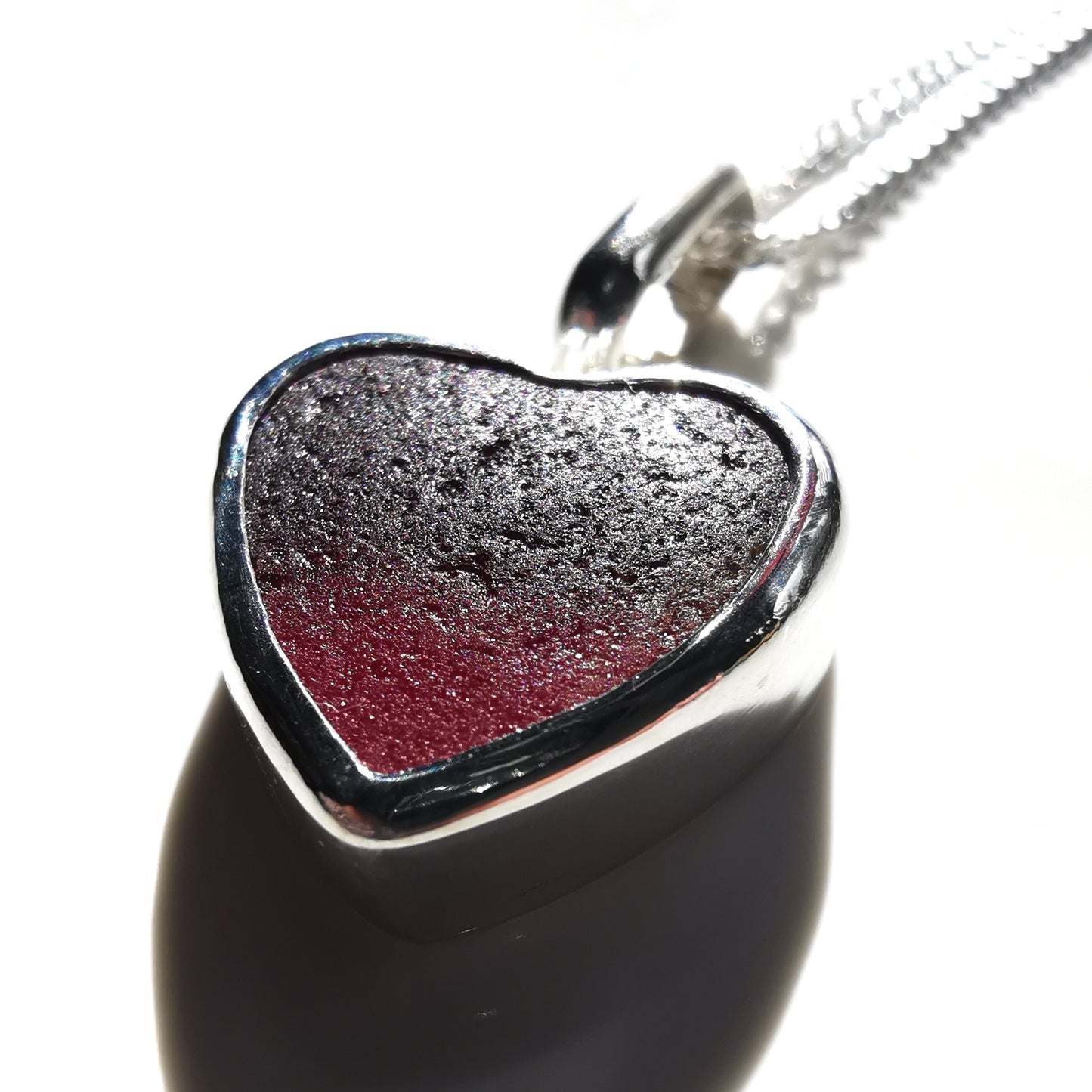 Burgundy red sea glass heart & sterling silver pendant.