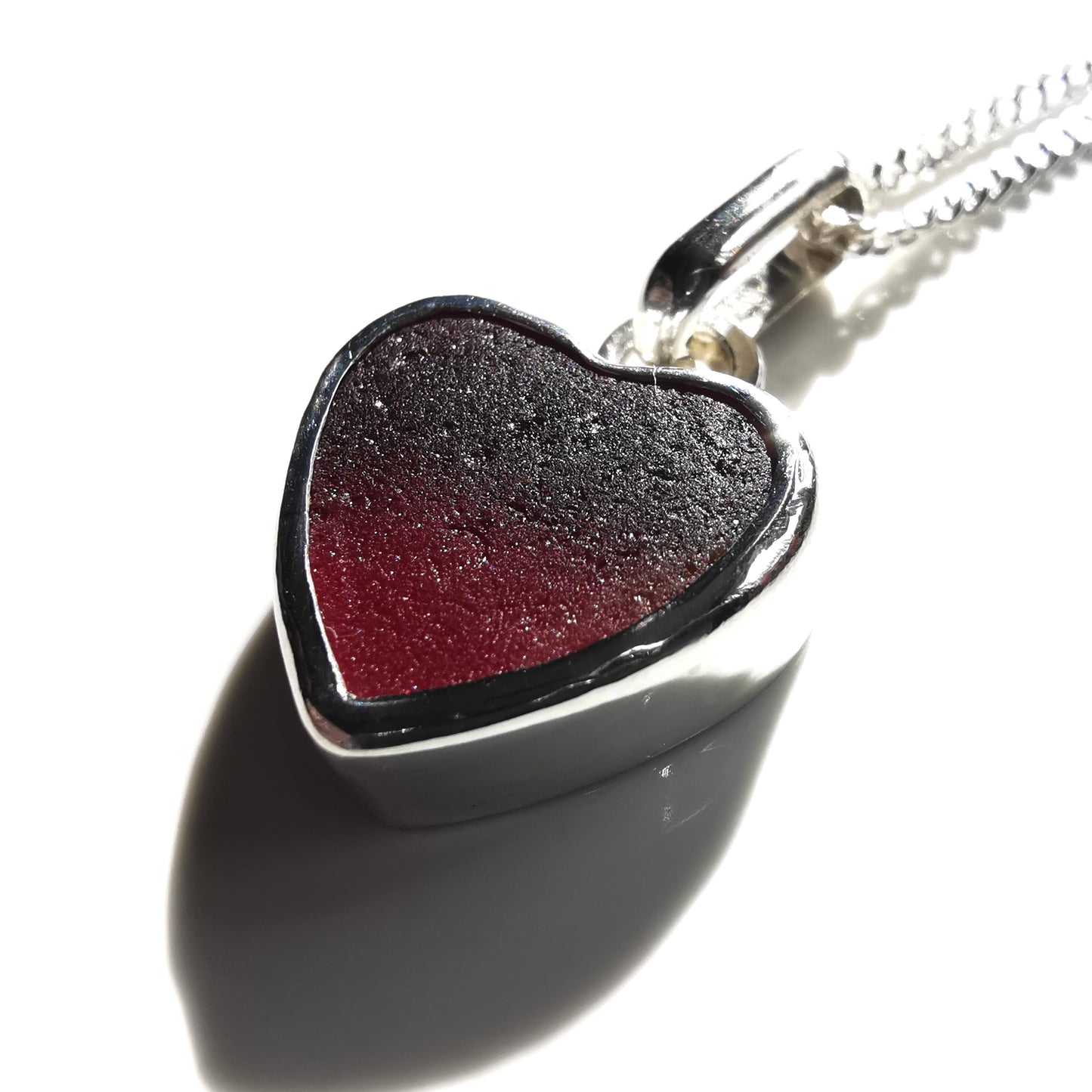 Burgundy red sea glass heart & sterling silver pendant.