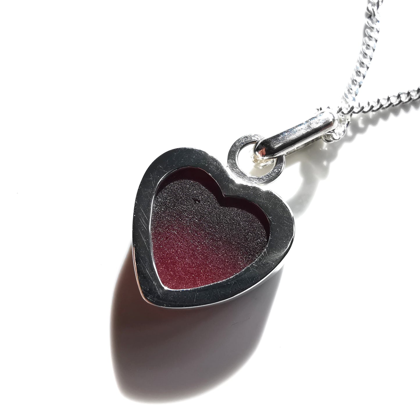 Burgundy red sea glass heart & sterling silver pendant.