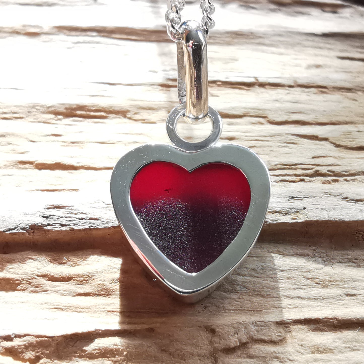 Burgundy red sea glass heart & sterling silver pendant.