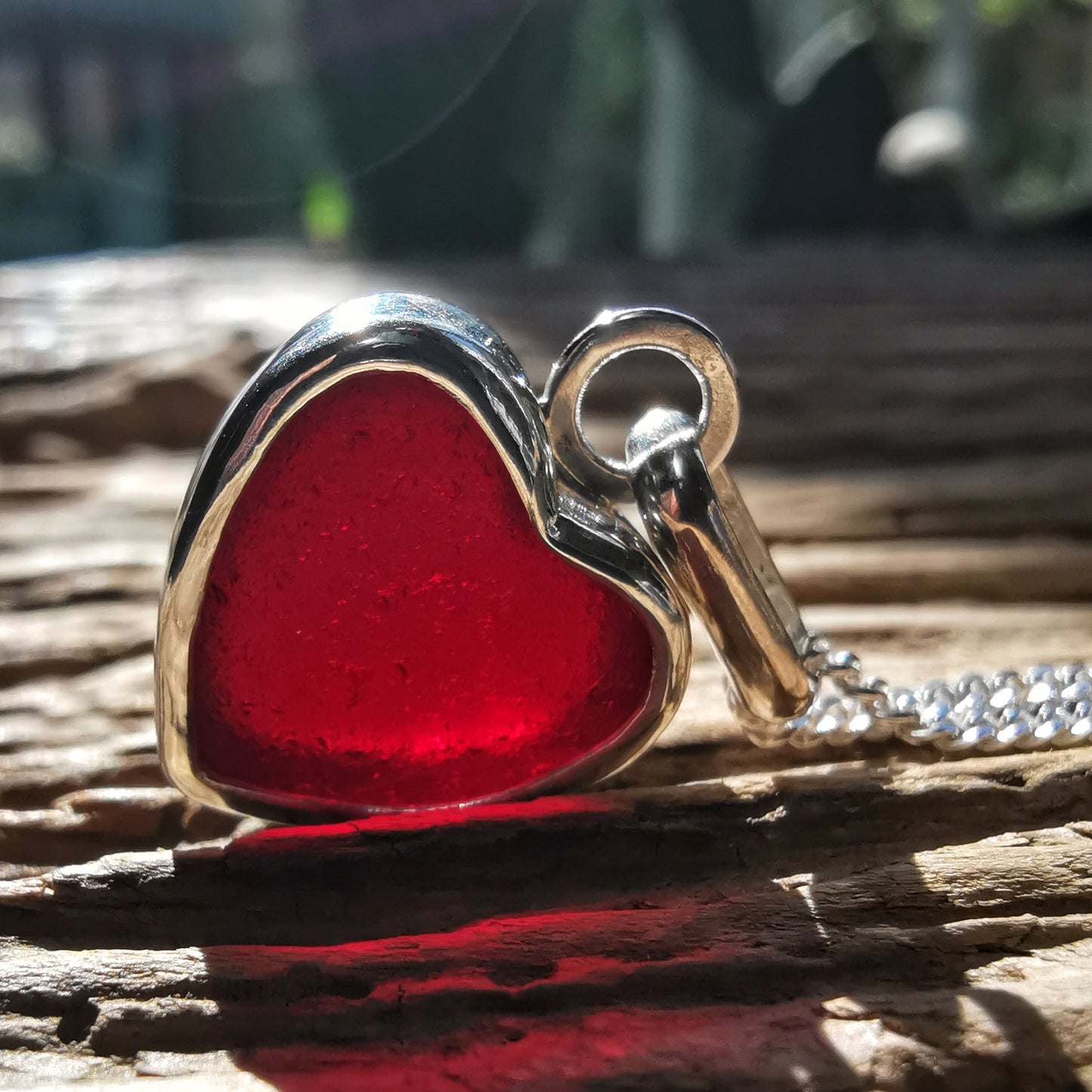 Burgundy red sea glass heart & sterling silver pendant.