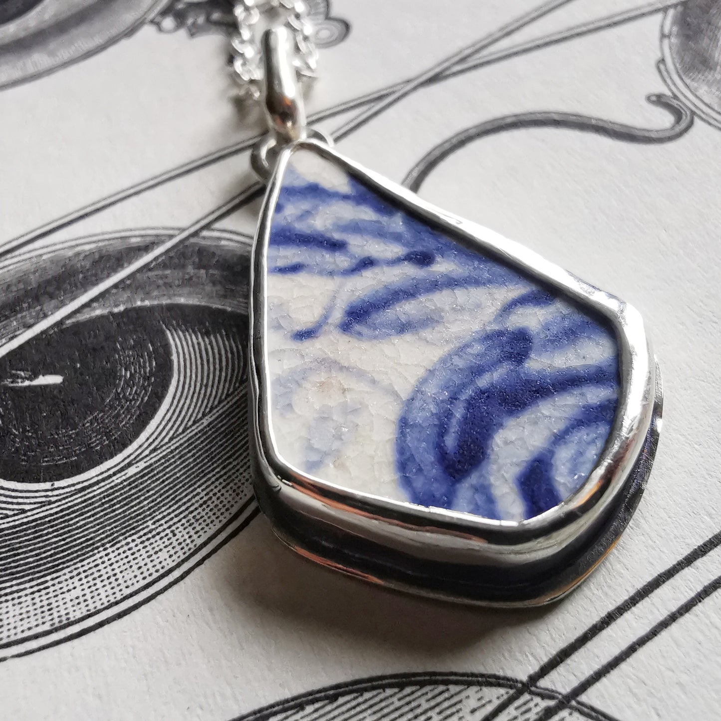 Scottish blue and white sea pottery & sterling silver pendant.