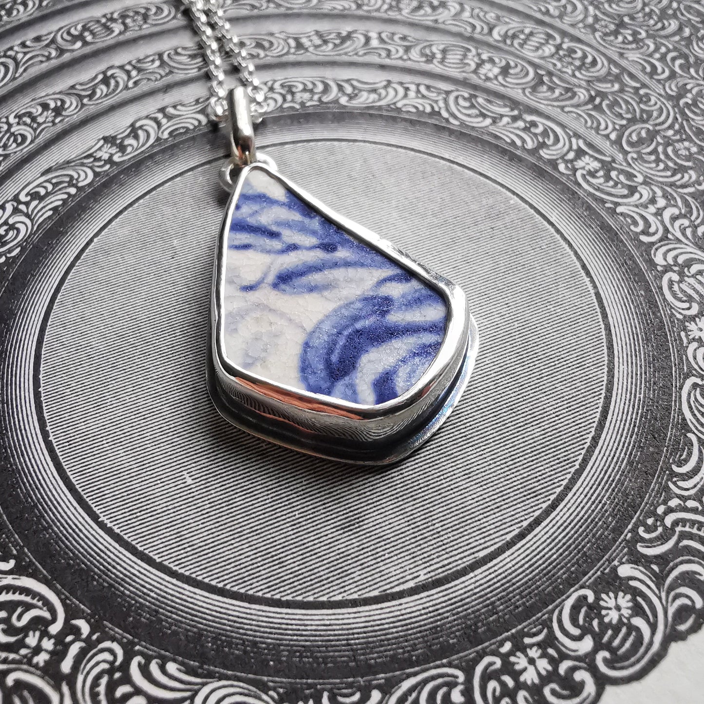 Scottish blue and white sea pottery & sterling silver pendant.