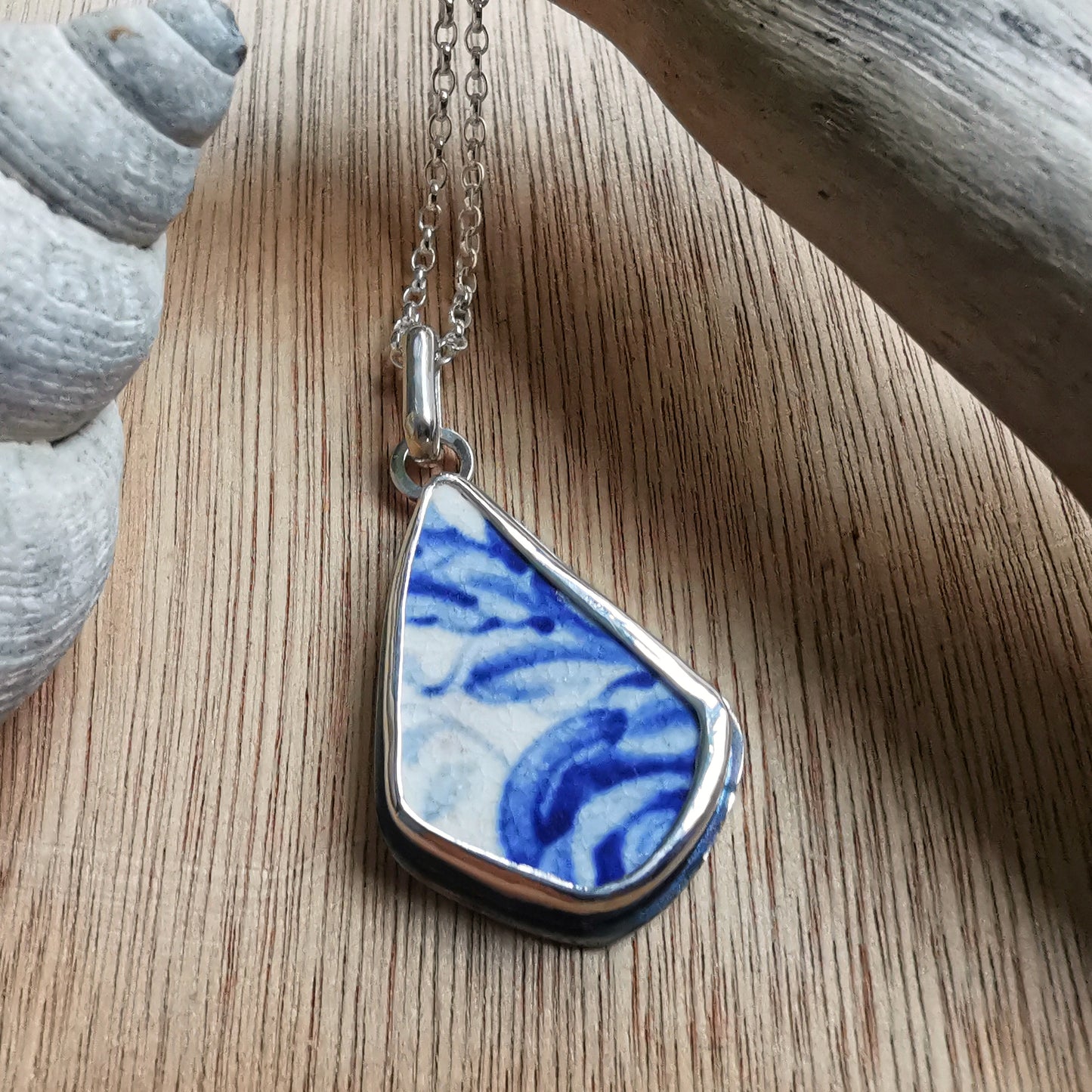 Scottish blue and white sea pottery & sterling silver pendant.