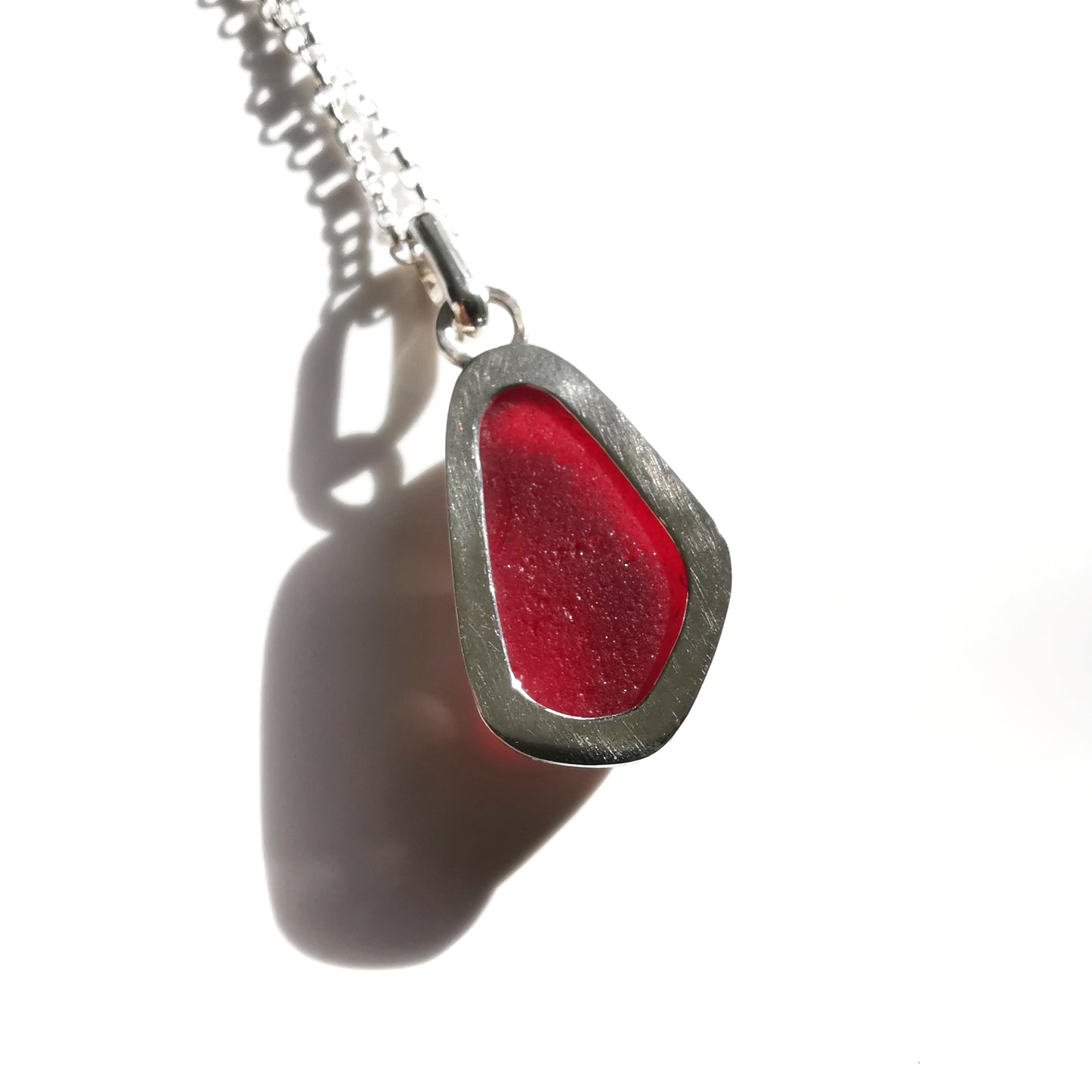 Red UV sea glass & sterling silver pendant.