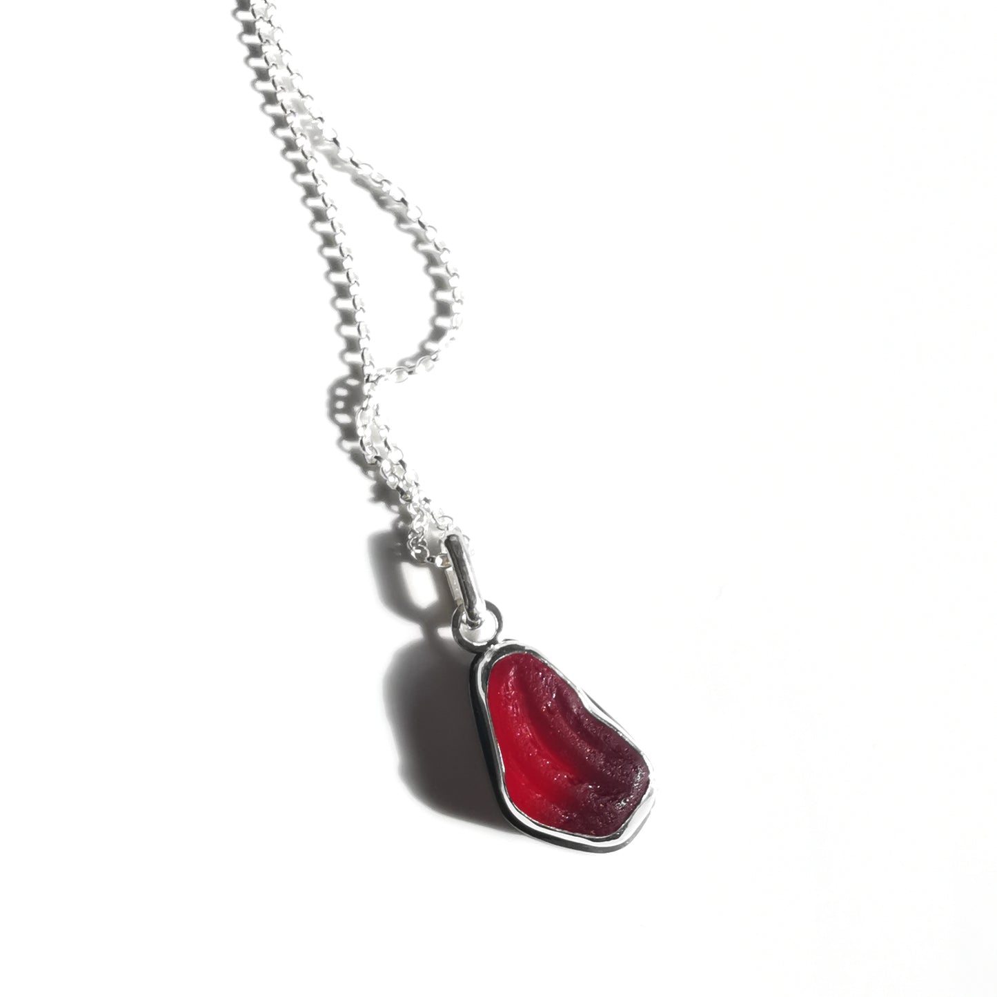 Red UV sea glass & sterling silver pendant.