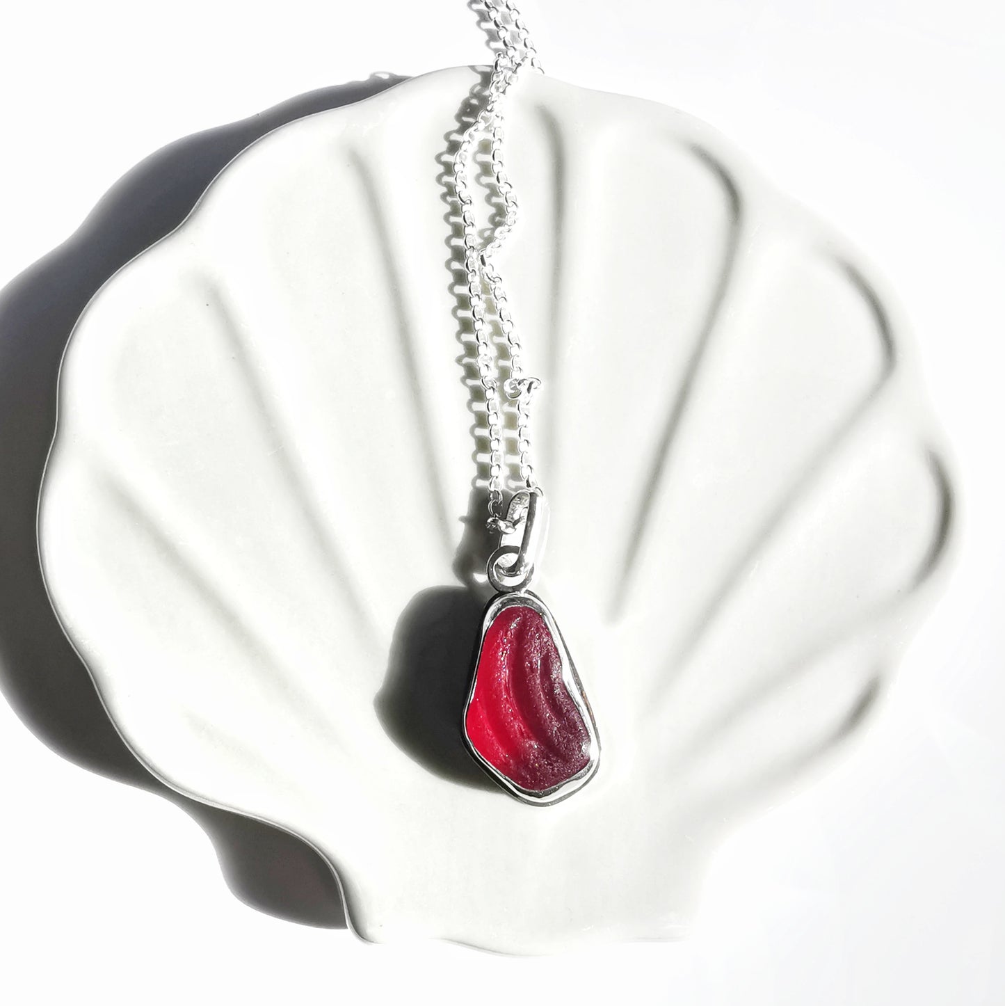 Red UV sea glass & sterling silver pendant.