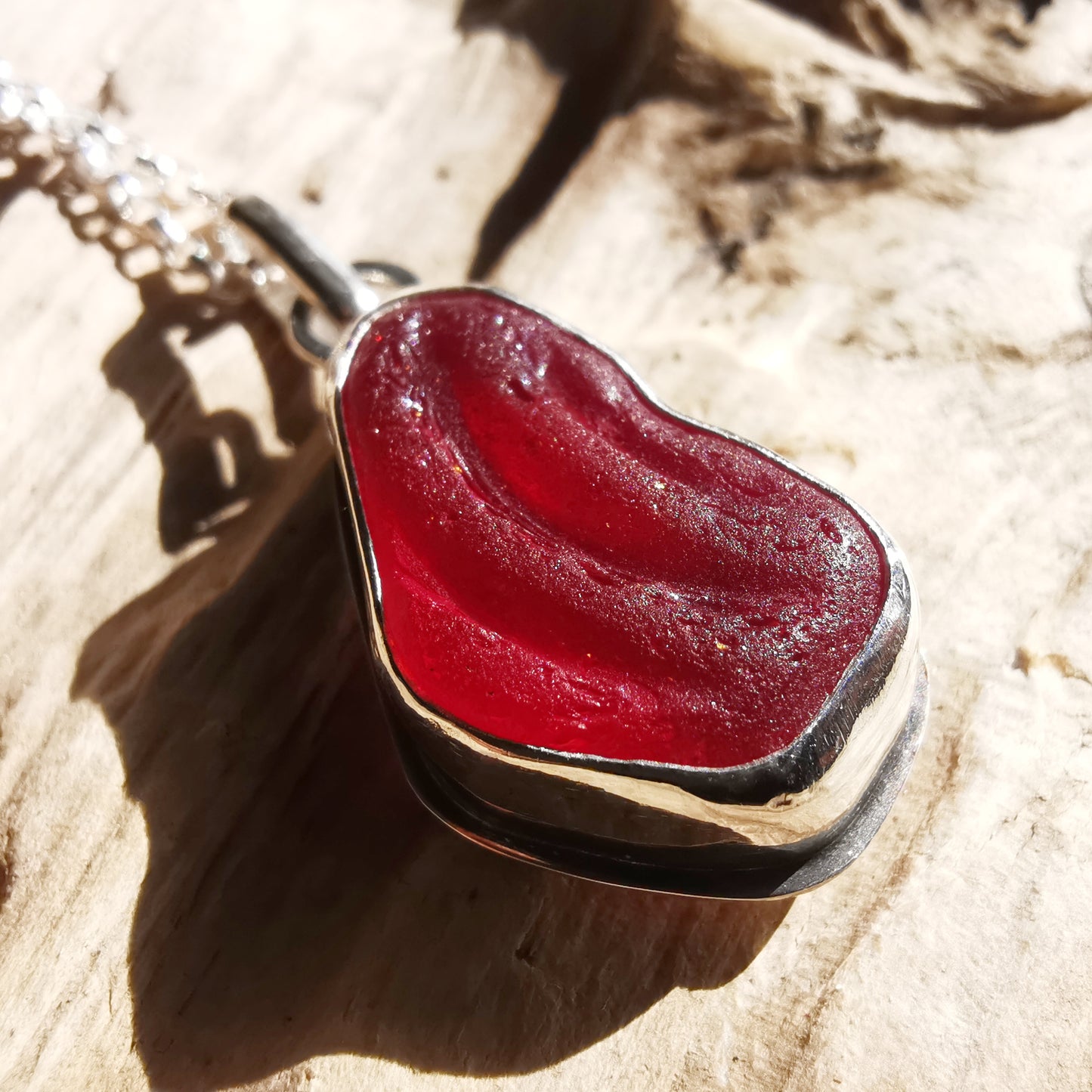 Red UV sea glass & sterling silver pendant.