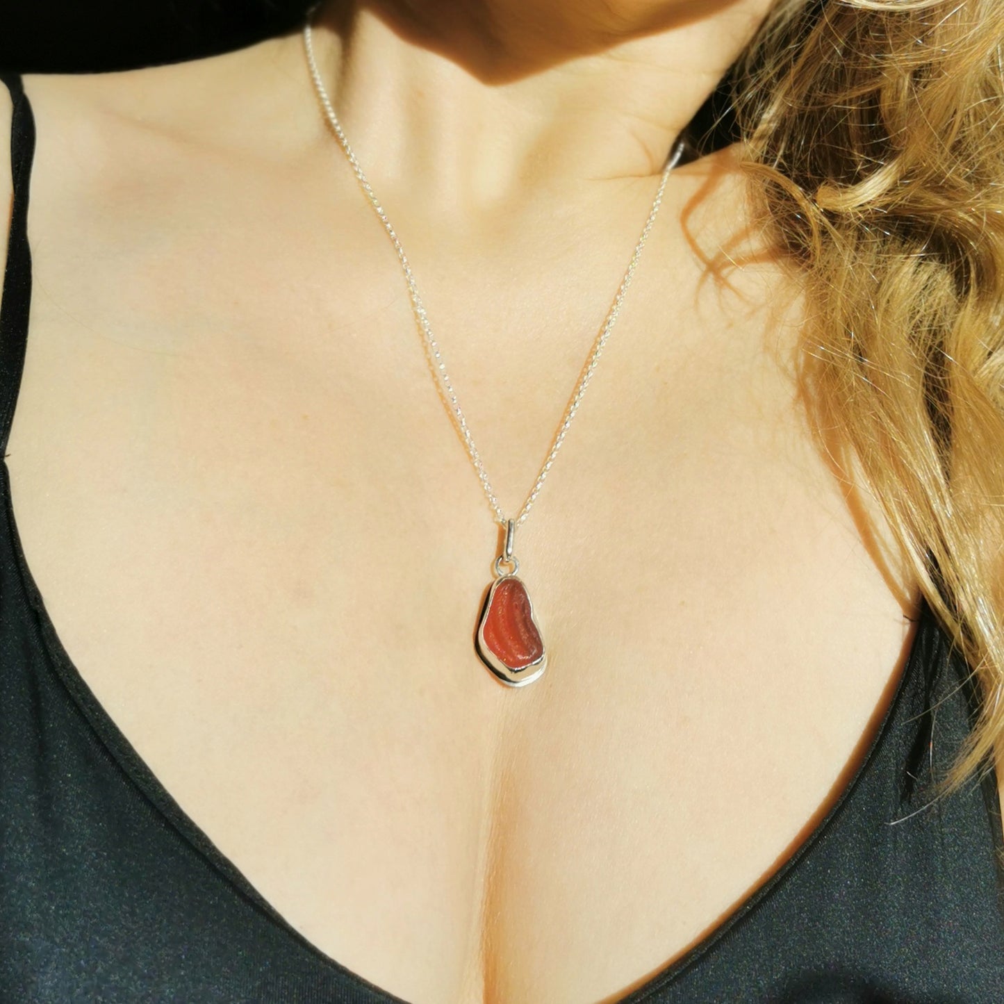 Red UV sea glass & sterling silver pendant.