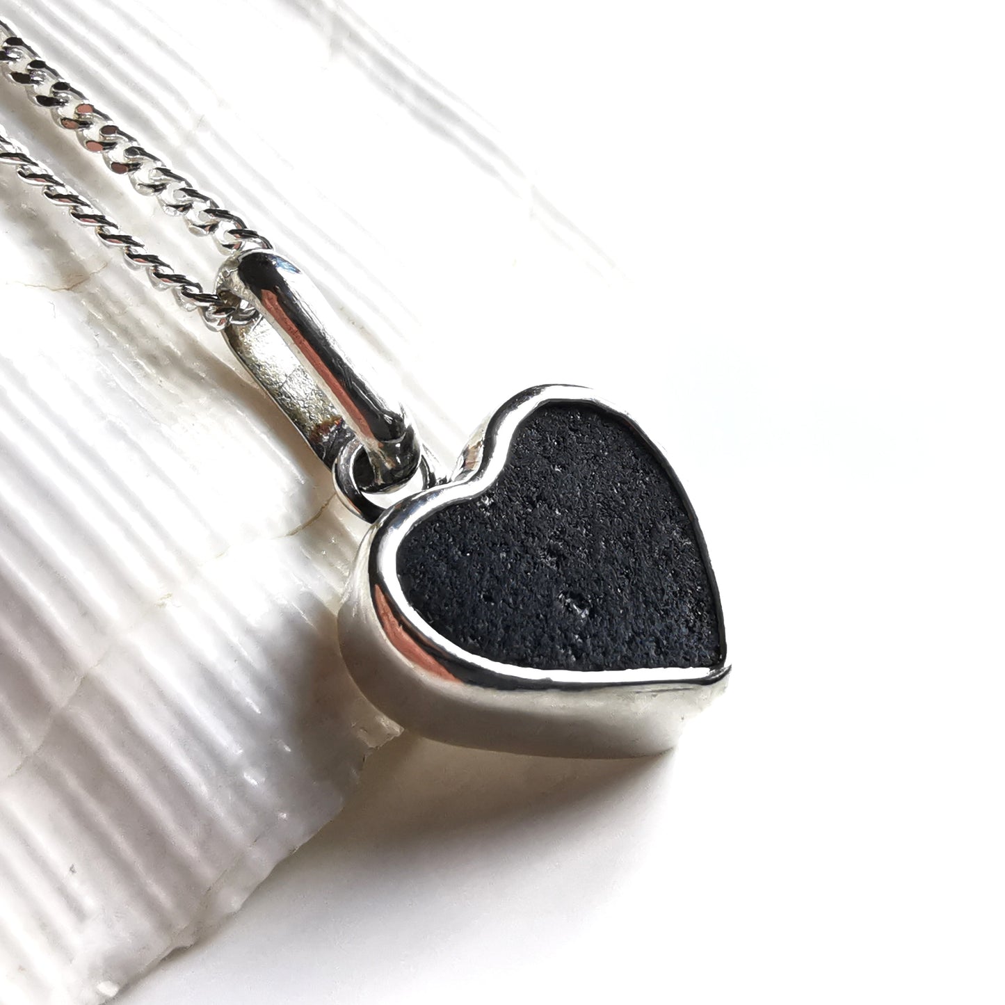 Tiny black Scottish sea glass heart & sterling silver pendant.