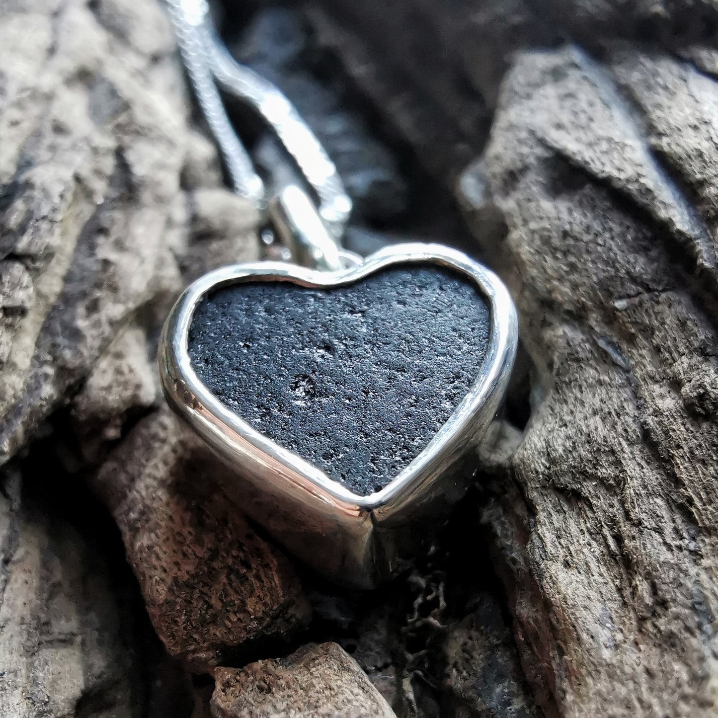 Tiny black Scottish sea glass heart & sterling silver pendant.