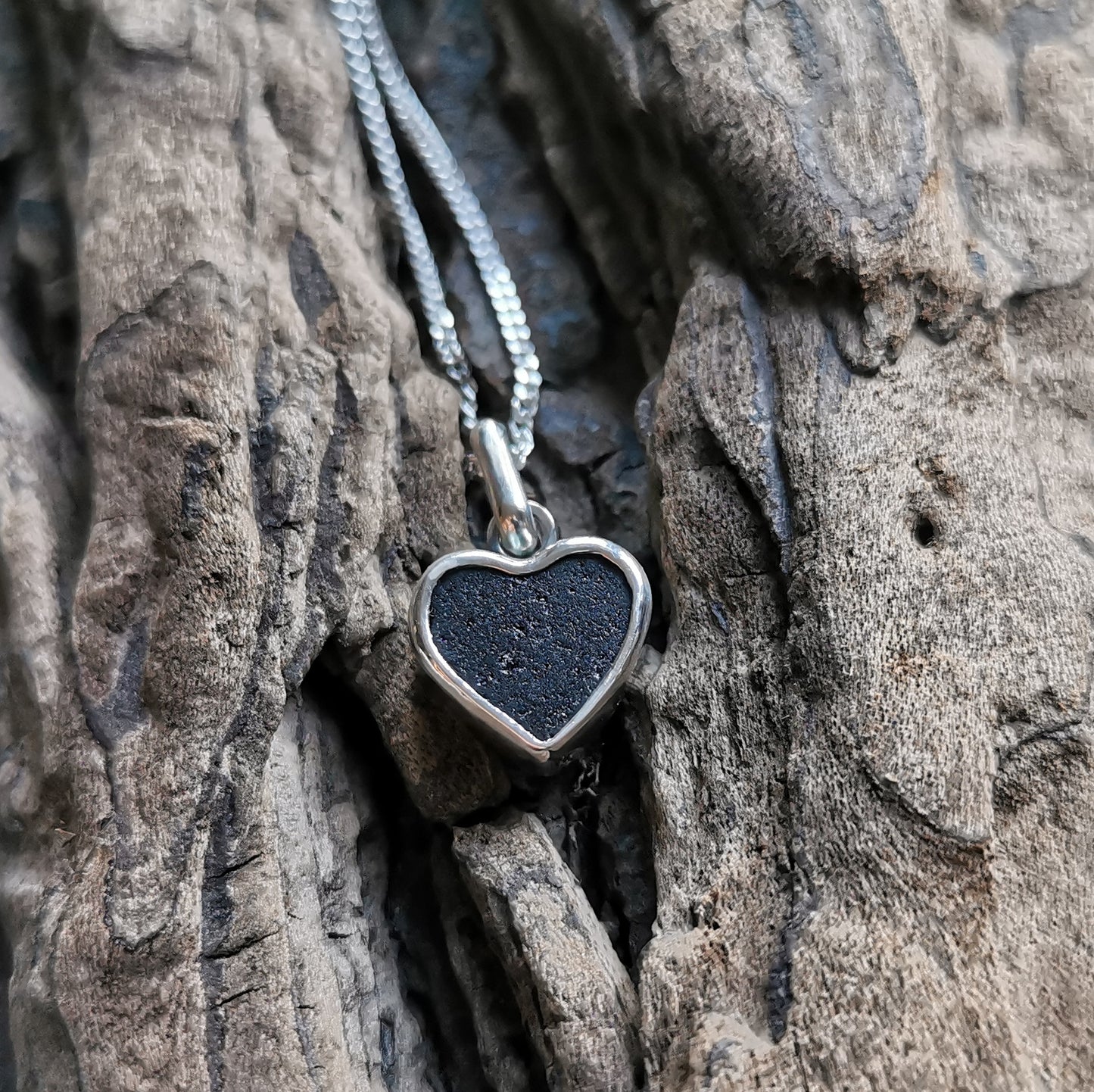 Tiny black Scottish sea glass heart & sterling silver pendant.