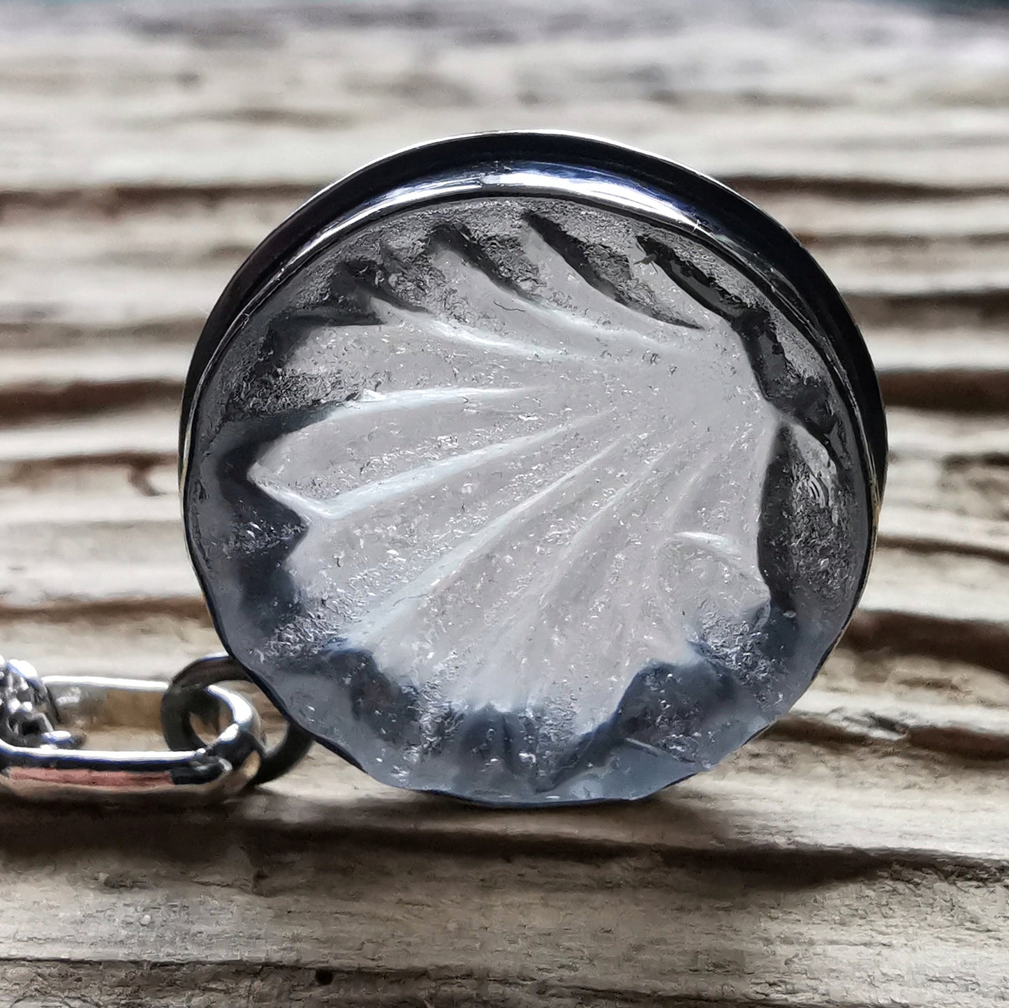 Clear sea glass & sterling silver pendant.