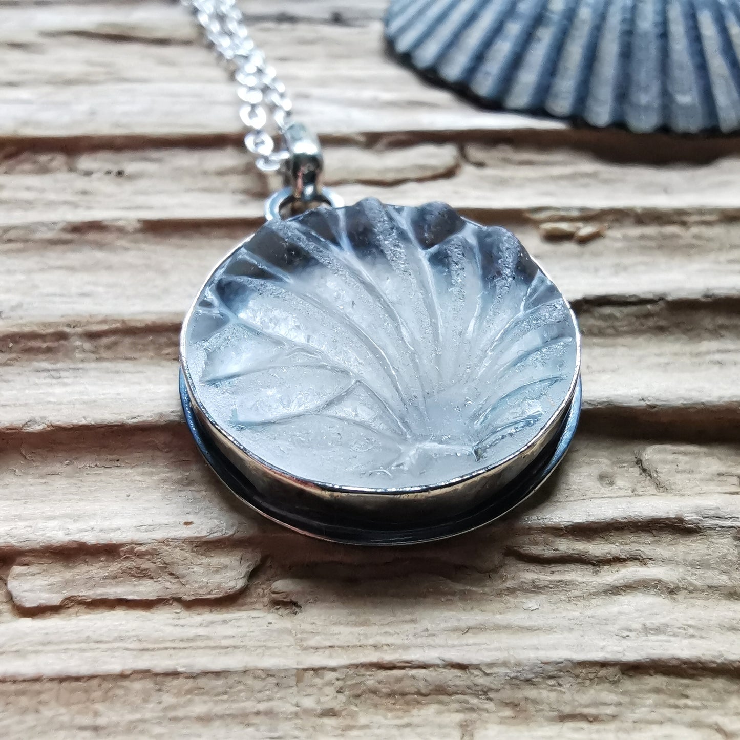Clear sea glass & sterling silver pendant.