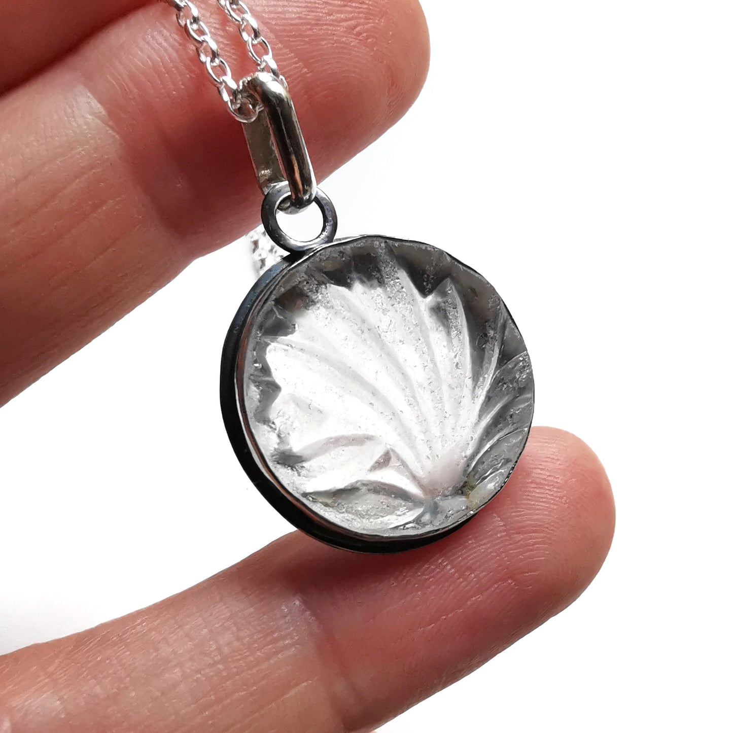 Clear sea glass & sterling silver pendant.