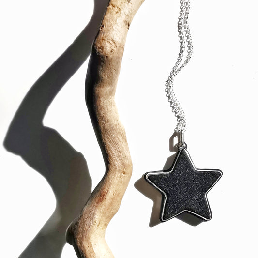 Scottish black sea glass star & sterling silver pendant.