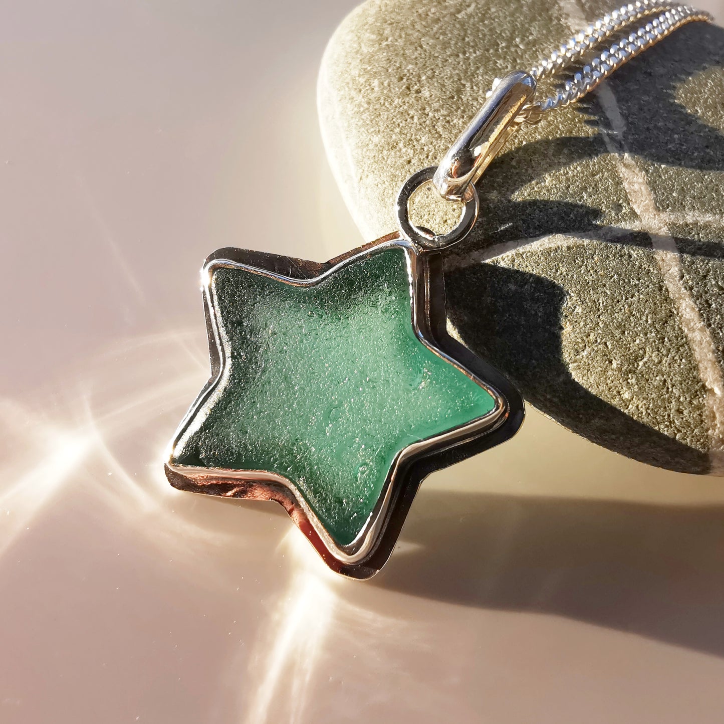 Scottish teal sea glass star & sterling silver pendant.