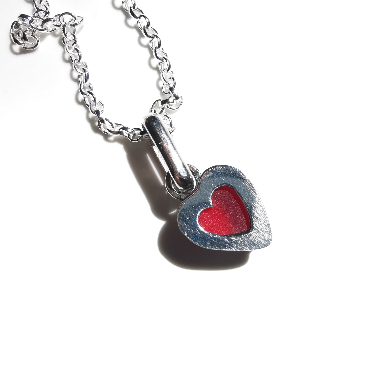 Tiny Scottish UV red sea glass heart & sterling silver pendant.