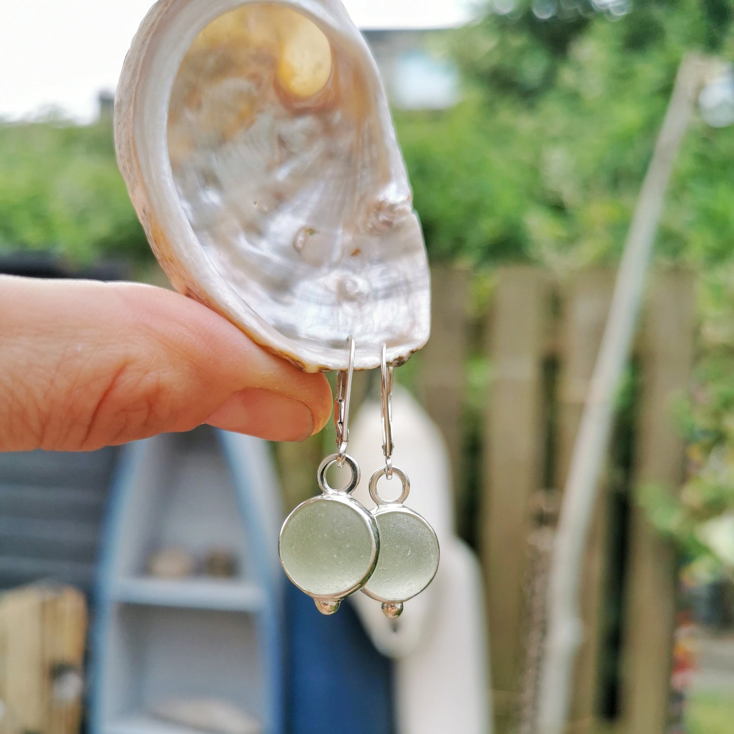Genuine Scottish green sea glass marbles and sterling silver earrings.