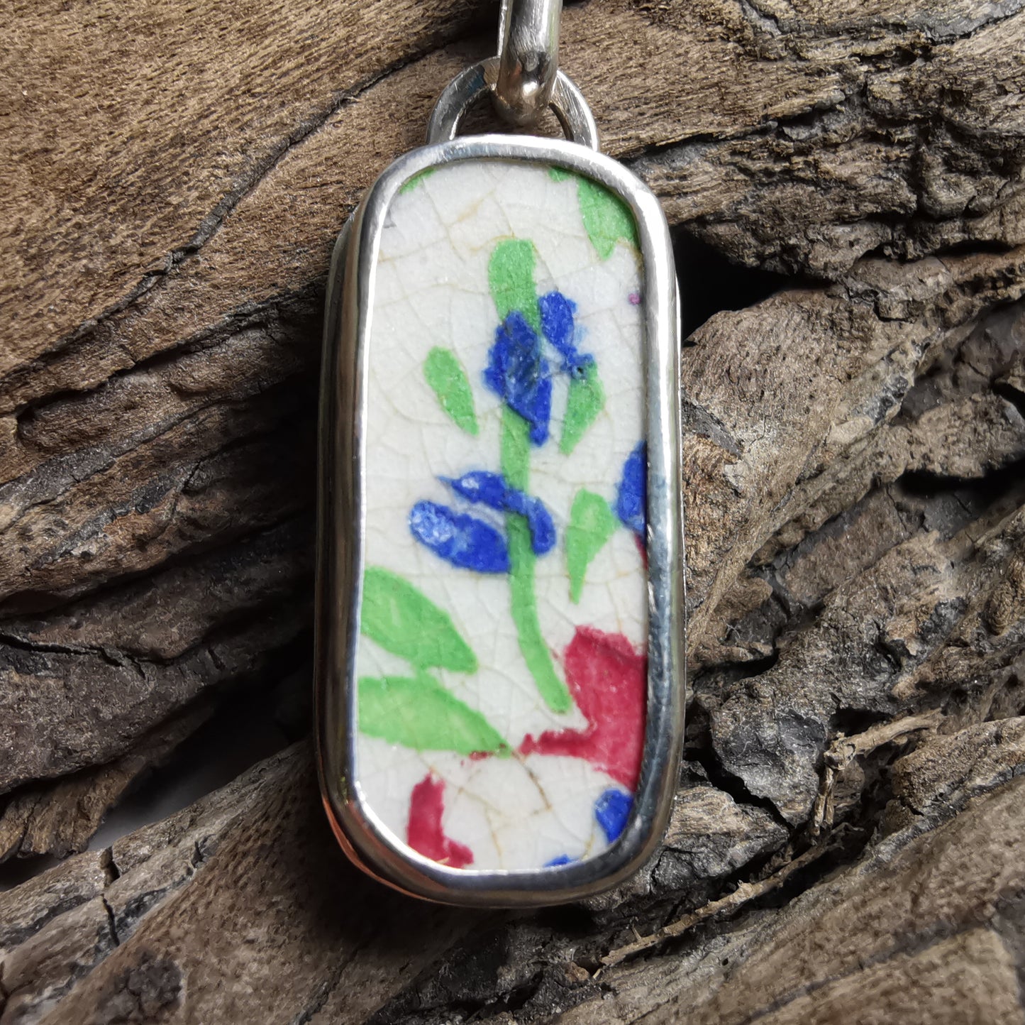 Scottish foliage pattern sea pottery & sterling silver pendant.