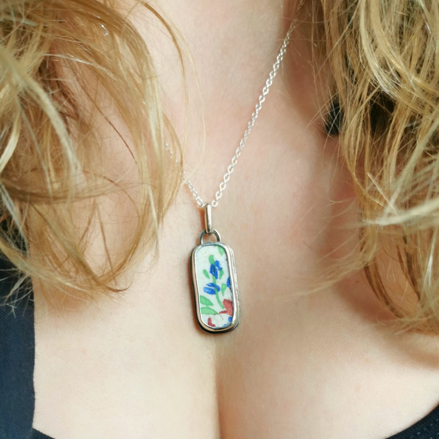Scottish foliage pattern sea pottery & sterling silver pendant.