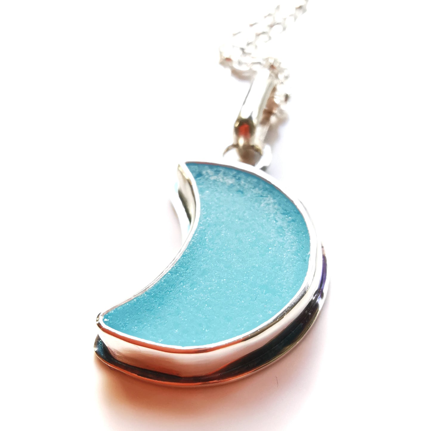 Aqua blue crescent moon sea glass & sterling silver pendant.