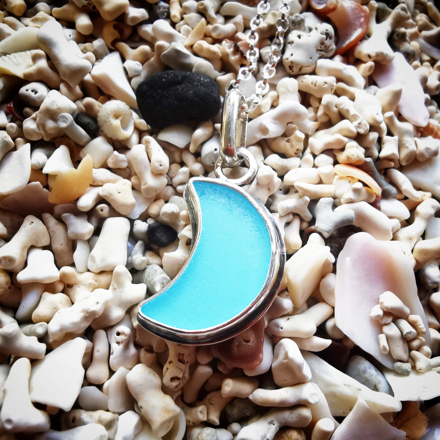 Aqua blue crescent moon sea glass & sterling silver pendant.