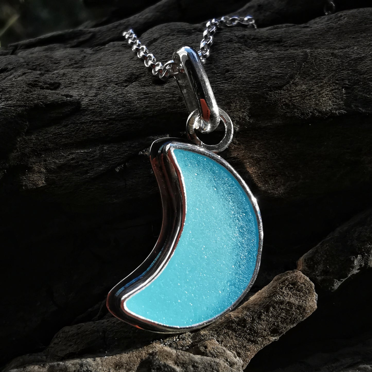 Aqua blue crescent moon sea glass & sterling silver pendant.