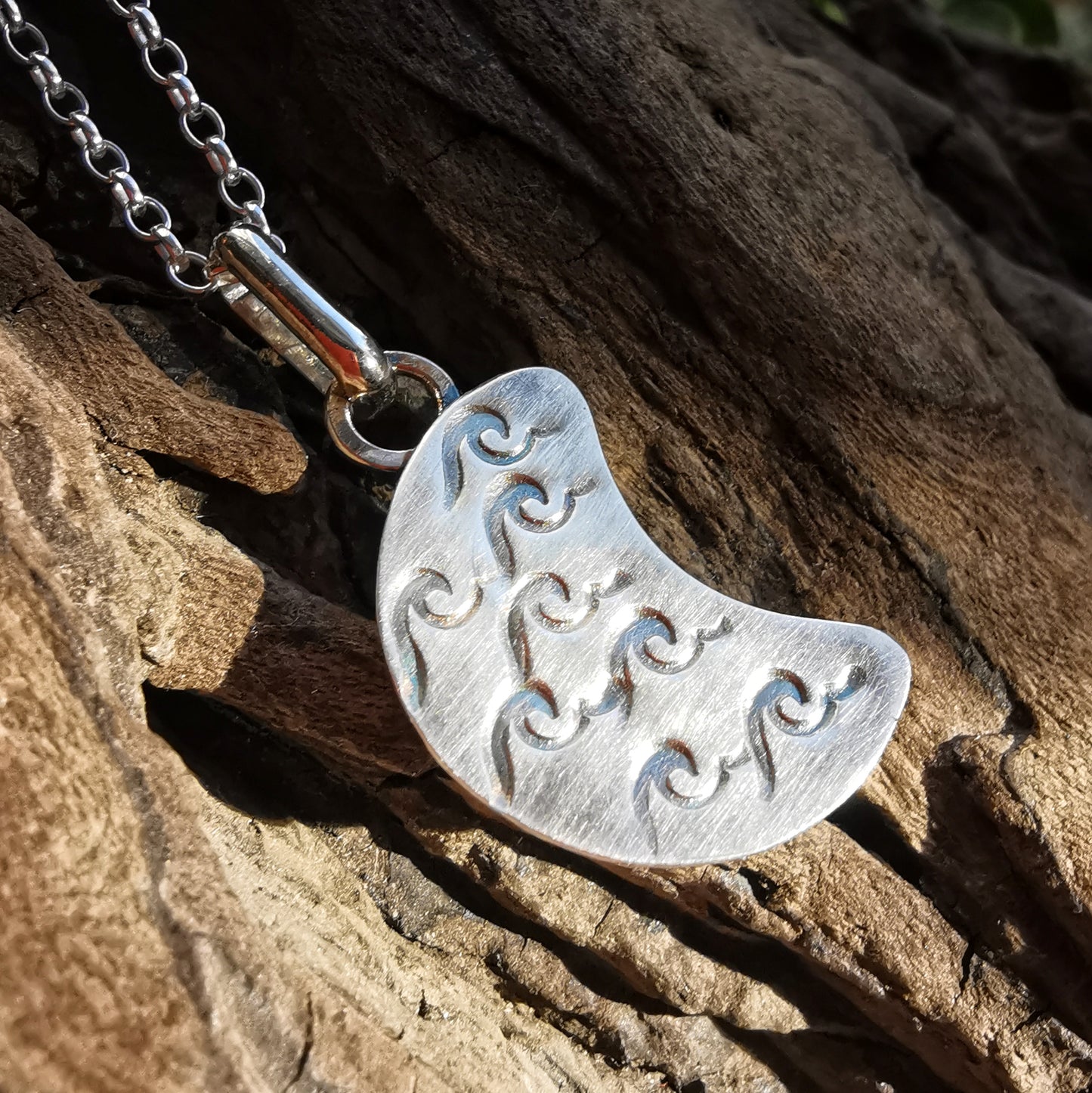 Aqua blue crescent moon sea glass & sterling silver pendant.