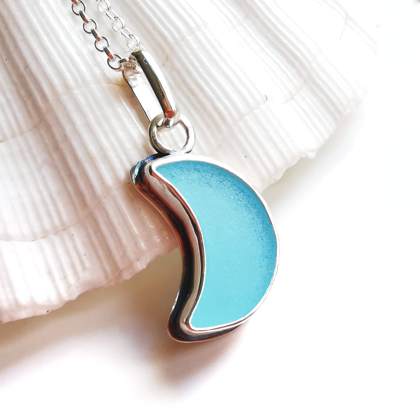 Aqua blue crescent moon sea glass & sterling silver pendant.