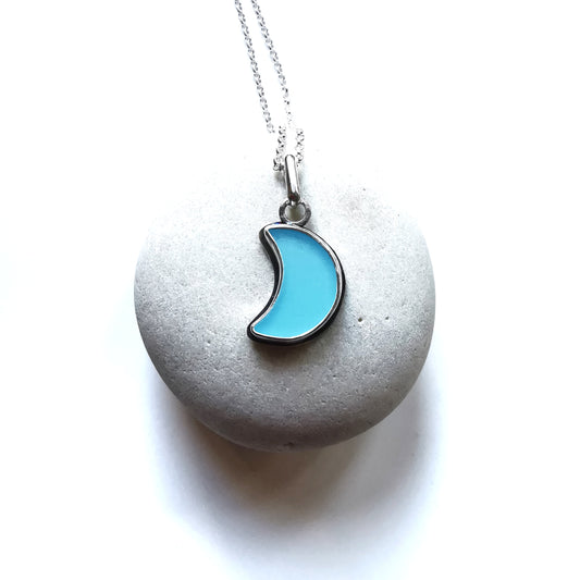 Aqua blue crescent moon sea glass & sterling silver pendant.