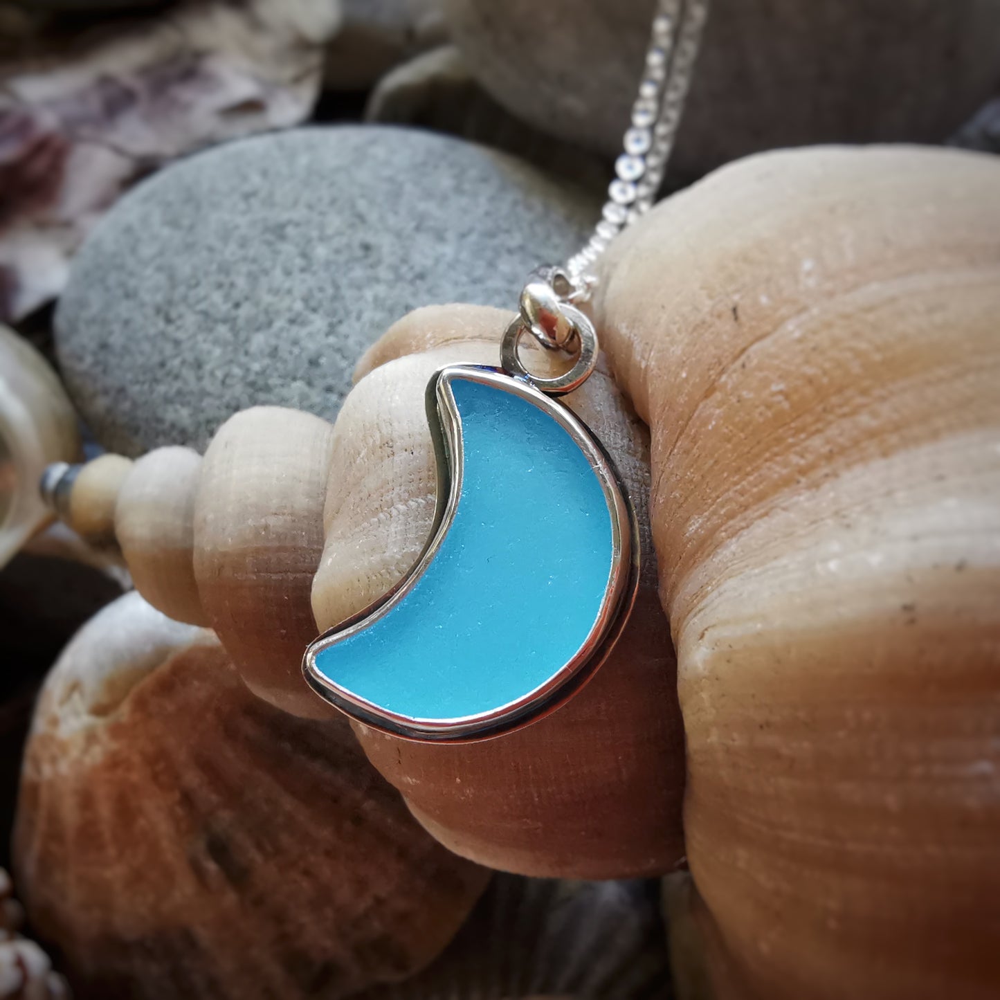 Aqua blue crescent moon sea glass & sterling silver pendant.