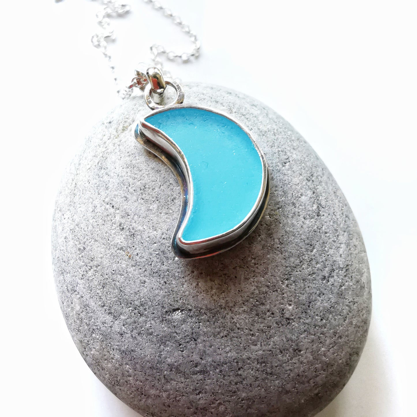 Aqua blue crescent moon sea glass & sterling silver pendant.