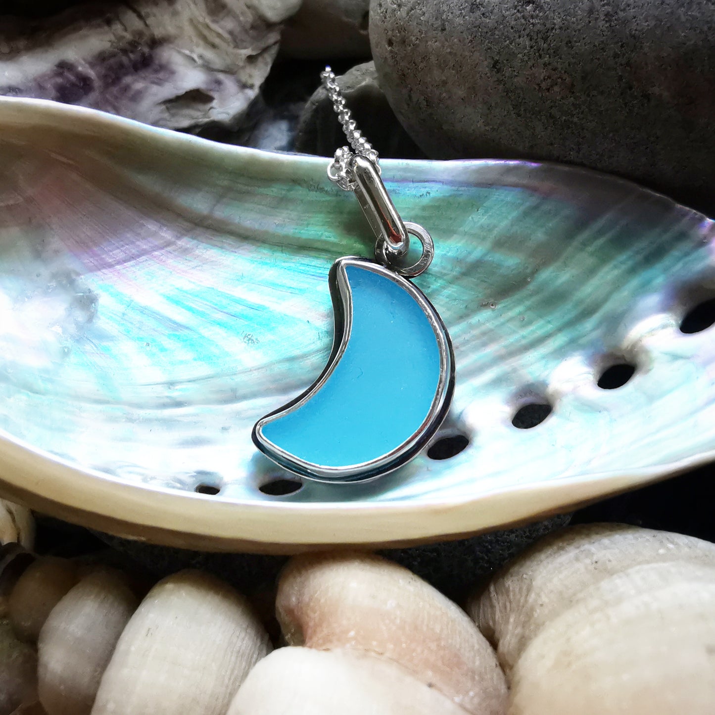 Aqua blue crescent moon sea glass & sterling silver pendant.