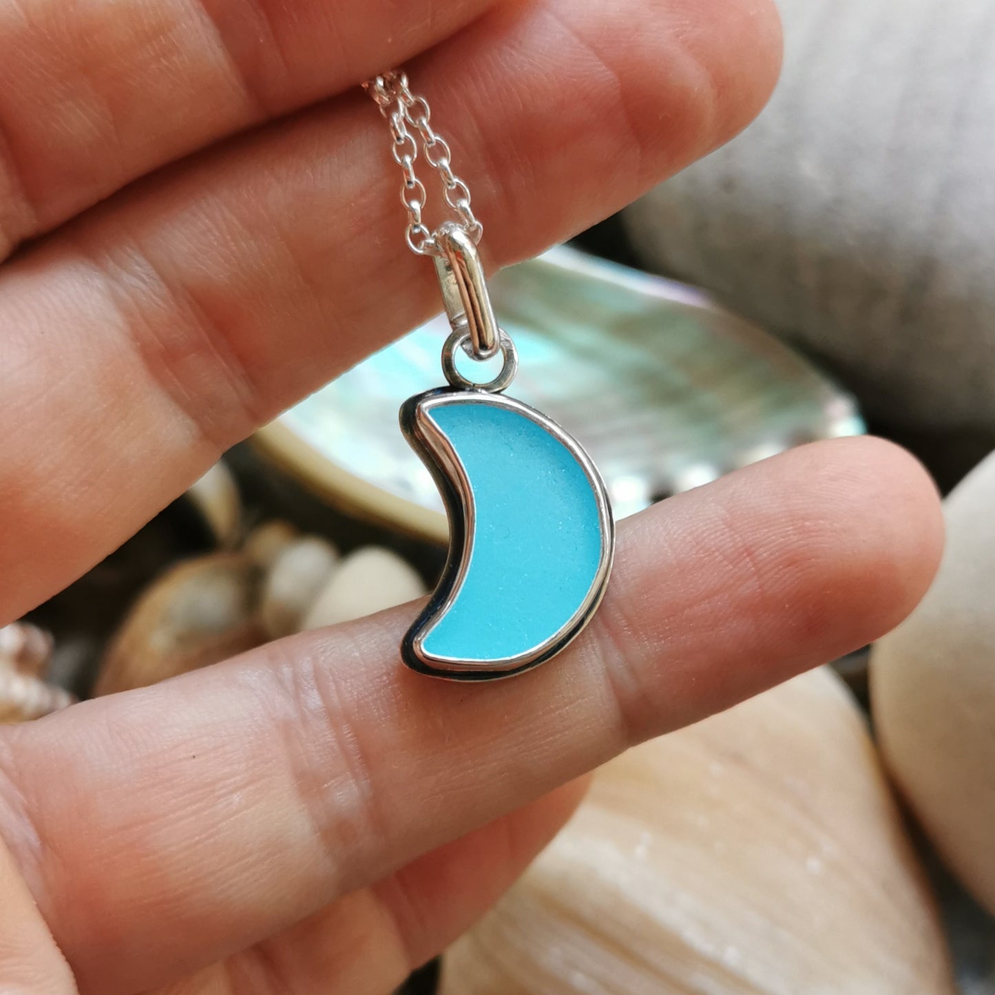 Aqua blue crescent moon sea glass & sterling silver pendant.