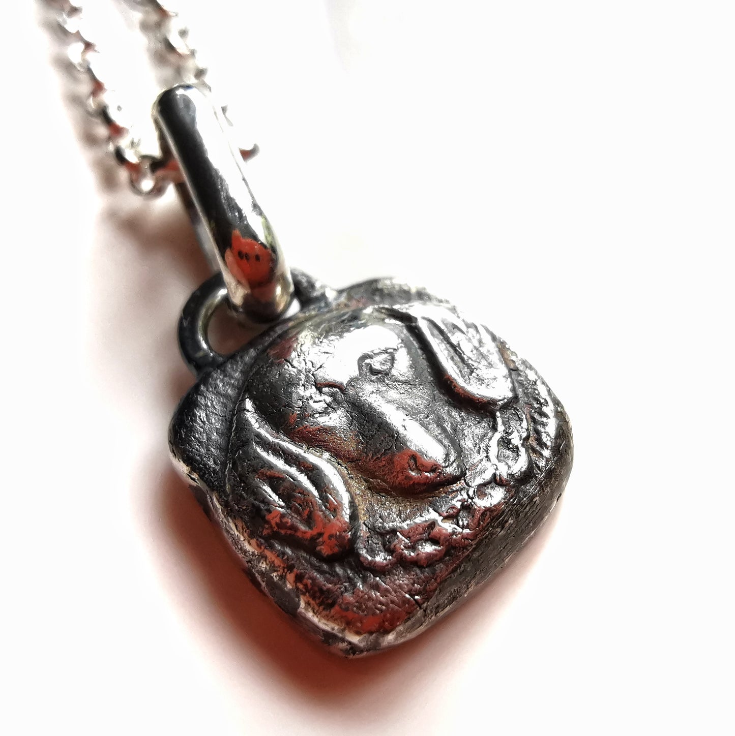 Silver dachshund pendant.