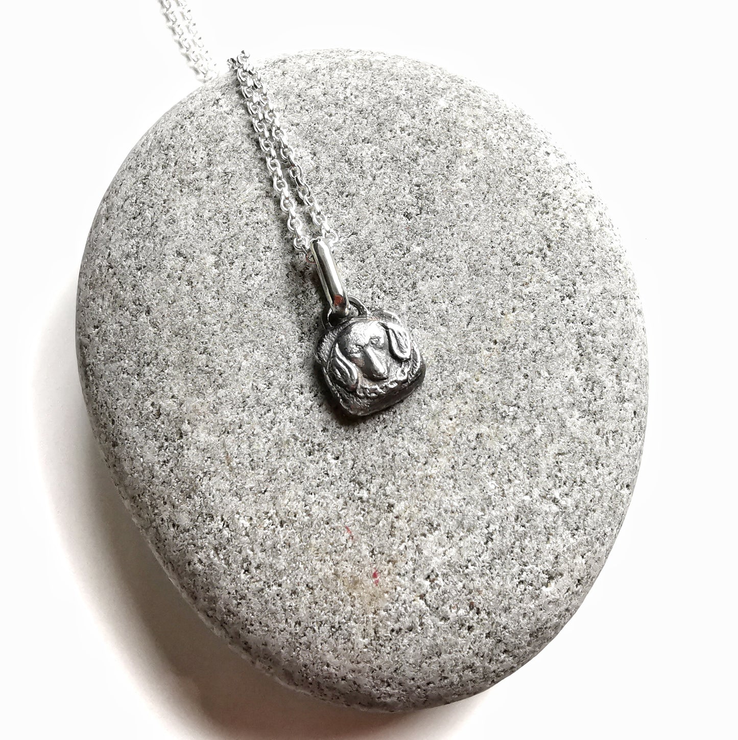 Silver dachshund pendant.