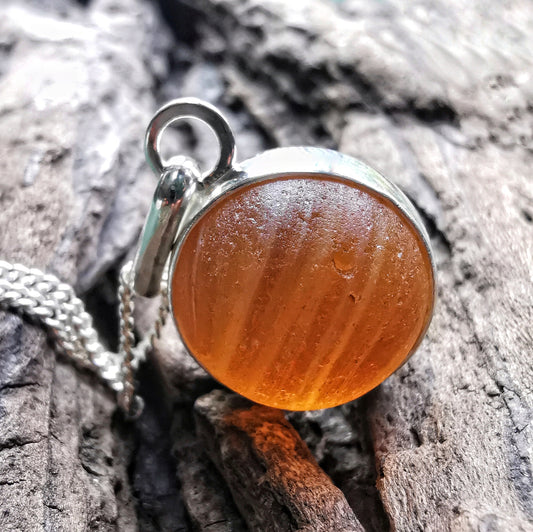Genuine Scottish brown sea glass marble & sterling silver pendant.