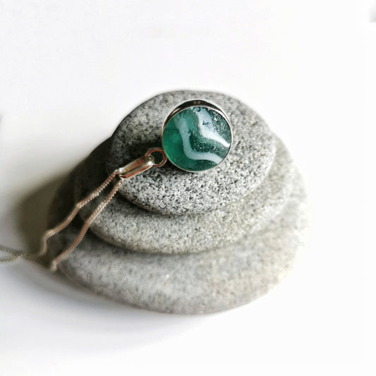 Scottish teal green sea glass marble & sterling silver pendant.